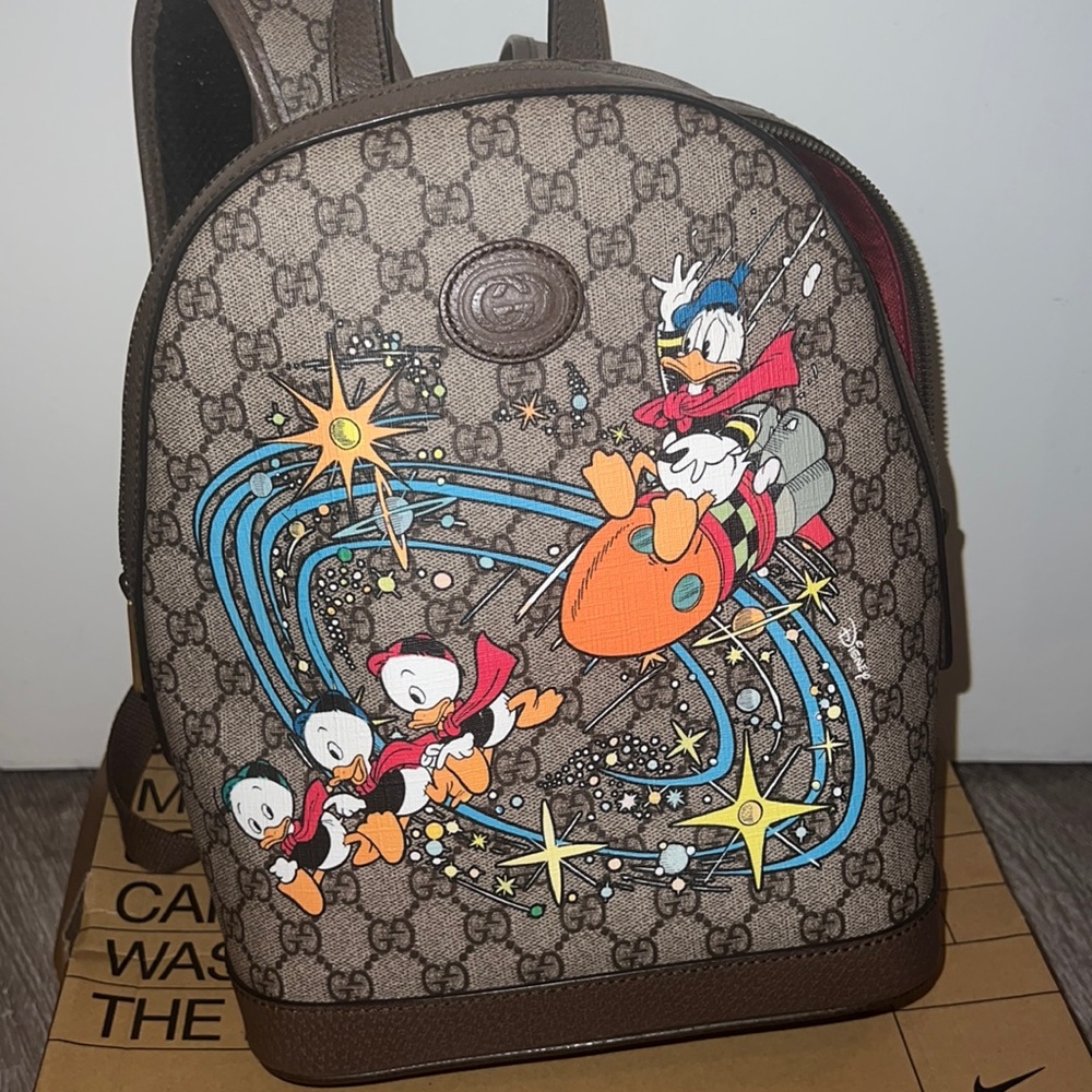 authentic gucci x disney donald duck backpack.